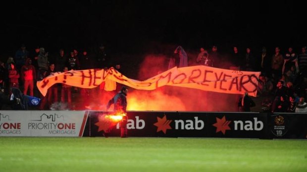 A flare is set off at the match between Tuggeranong United and Melbourne Victory.