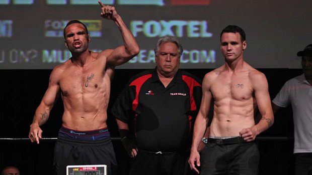 The storm before the calm &#8230; a feisty Anthony Mundine, left, tries some pre-bout tactics on a cool Daniel Geale at their weigh-in on Tuesday.