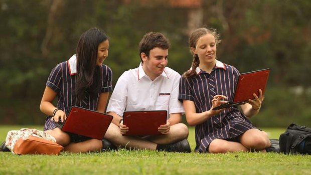 Seat of learning ... Chatswood High School students with their laptops, from left, Samantha, Daniel and Rachel.