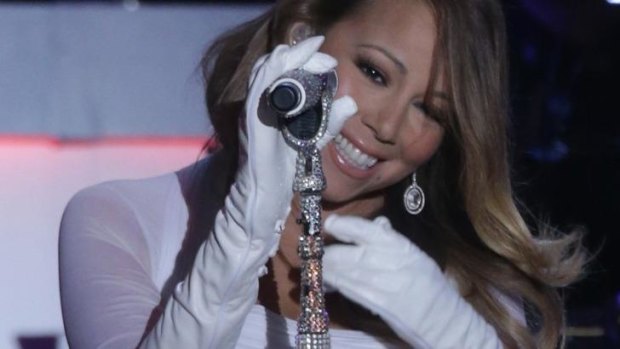 Mariah Carey says she might surprise fans with a brand new song.