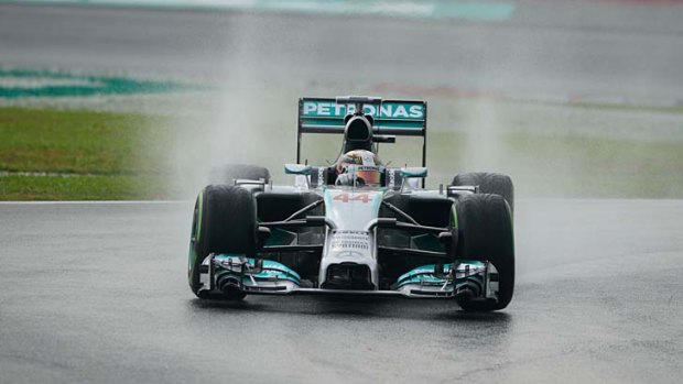 Mercedes driver Lewis Hamilton of Britain takes a corner during the first qualifying session of the Formula One Malaysian Grand Prix at the Sepang circuit near Kuala Lumpur on Saturday.