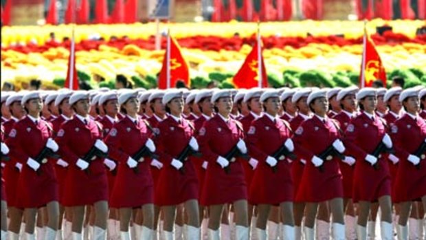 Women members of a civilian reserve force under China's military march past Tiananmen Square in Beijing.