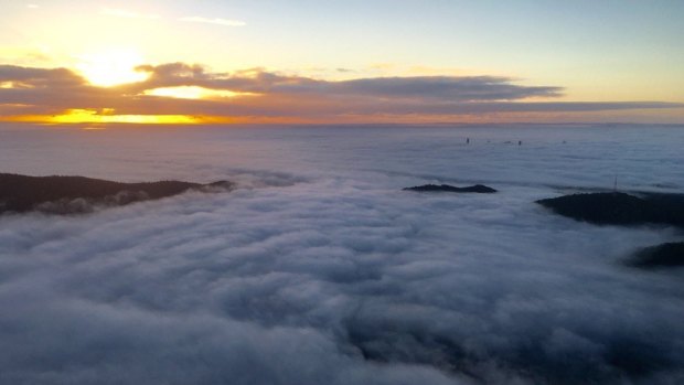 An aerial view of the fog laying claim to Brisbane on Tuesday morning.