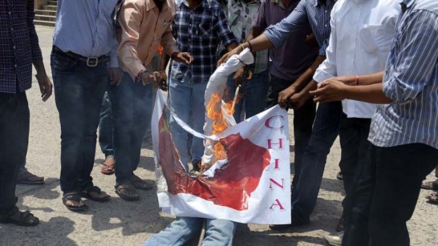 Dispute: Indian students of Akhila Bharatiya Vidya Parishad (ABVP) burn a Chinese flag and an effigy during a protest at Osmania University in Hyderabad.