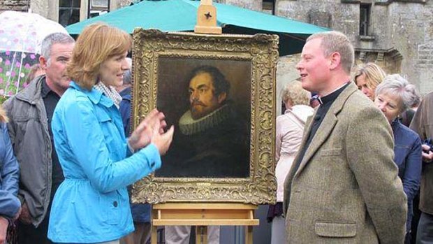 A valuable find: <i>Antique Roadshow's</i> Fiona Bruce and Father Jamie MacLeod with the portrait.