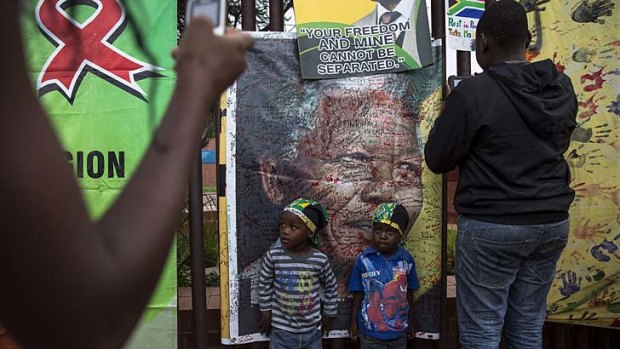 Citizens show their respect for Mandela in Soweto, South Africa.