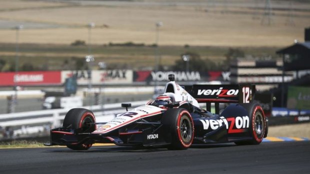 Will Power leads the way at the third turn in the IndyCar race on Sunday.