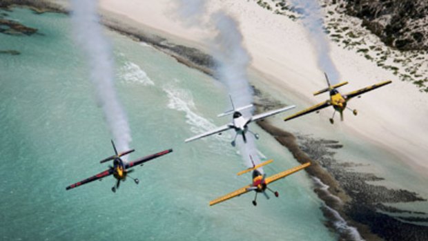 Competitors in the Red Bull Air Race World Series fly in formation over part of the Western Australian coast.