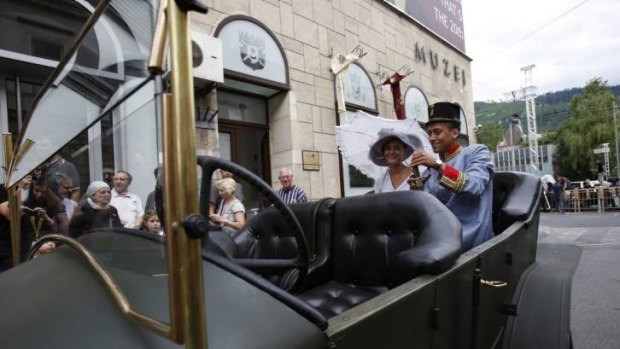 Keen for a photo: Tourists in a replica of the Graf & Stift car at the spot where Gavrilo Princip assassinated Austro-Hungarian heir to the throne Archduke Franz Ferdinand and his wife, Sofia, on June 28, 1914.