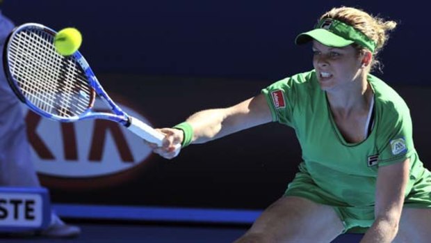 Kim Clijsters returns against Vera Zvonareva of Russia.