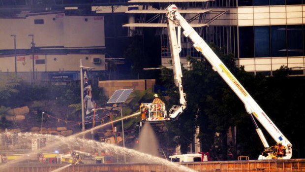 A firefighter battles the flames at the Barangaroo worksite on Wednesday.