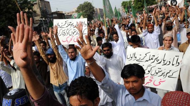 Pakistani Sunni Muslims shout slogans during a protest in Karachi against the suicide bomb attacks on the shrine of Muslim Sufi saint Hazrat Syed Ali bin Usman Hajweri.