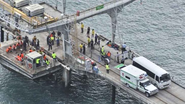 Survivors ... suspected asylum seekers arrive at Christmas Island today.