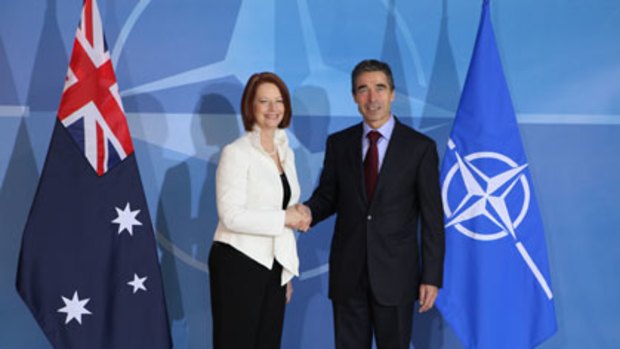 Julia Gillard meets the head of NATO, Anders Rasmussen, in Brussels.
