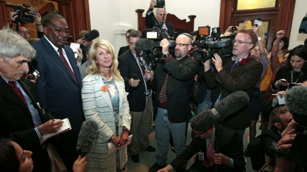 State Senator Wendy Davis is surrounded by media after the Democrats defeated the anti-abortion bill SB5, which was up for a vote on the last day of the legislative special session June 25, 2013 in Austin, Texas.
