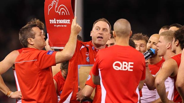 John Longmire and the Swans have adjusted and today are perched atop the AFL ladder, a game clear of their rivals.