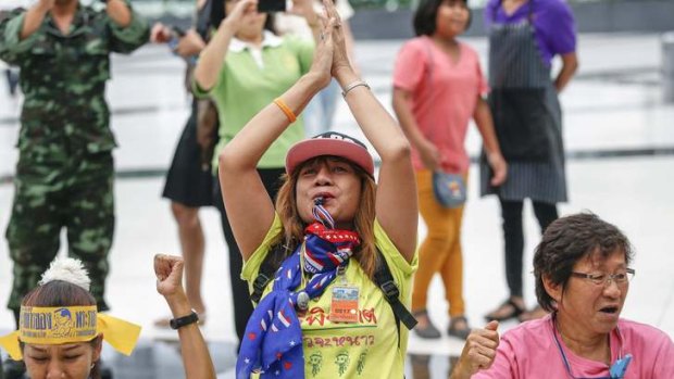 Anti-government protesters celebrate the verdict of the Constitutional Court.