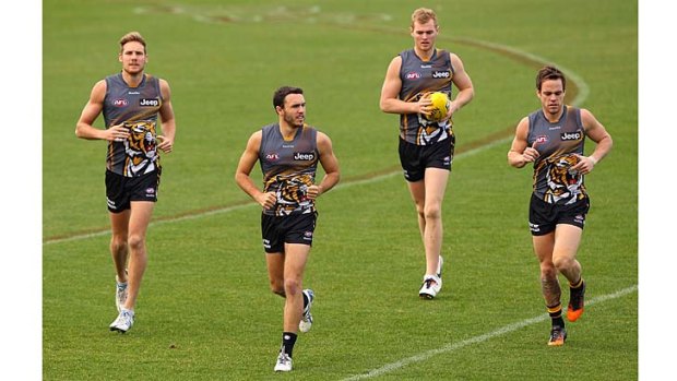 Richmond players run laps during a training session on Tuesday. The team has built a nice little buffer for itself.