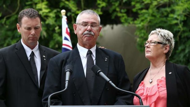 Corporal Baird's father Doug is comforted by his wife Kaye and son  Brendan as they family address the media.