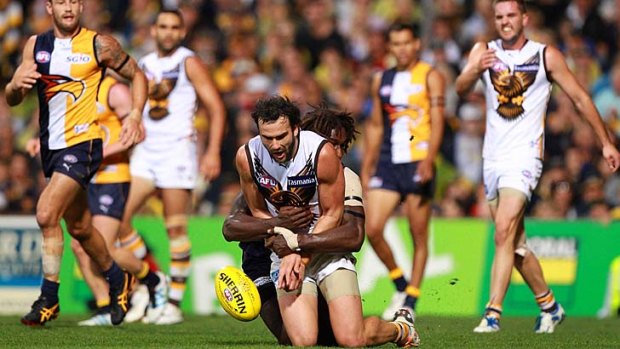 'House of Pain': Jordan Lewis is tackled by Nic Naitanui during the Hawks' loss to West Coast in round four last year.