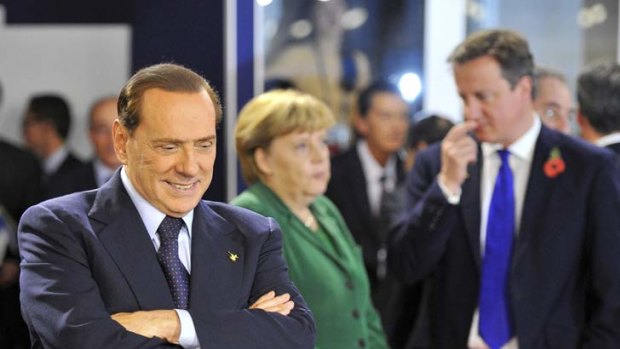 Silvio Berlusconi flew to the G20 conference in Cannes to convince EU leaders  that his economic stimulus package was enough to relaunch the Italian economy.
