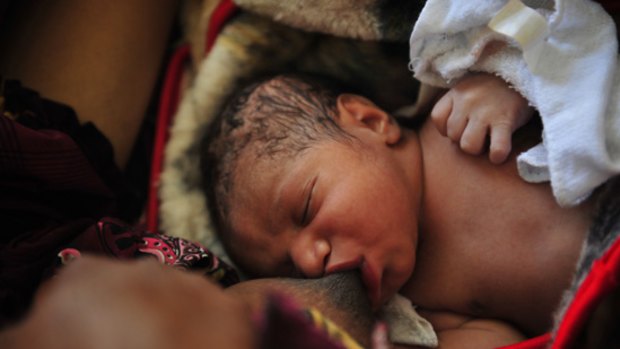 A new baby feeds in the hospital in Goroka , Eastern Highland Province, in Papua New Guinea. The image featured in Age photographer Jason South's Walkley award-winning photographic essay.