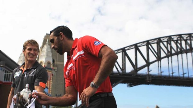 Silverware &#8230; Luke Power and Adam Goodes with the inaugural Sydney Derby trophy yesterday.