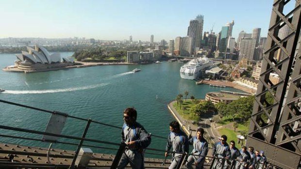 Novel workout … Sri Lankan cricket team members scale the Harbour Bridge in near-perfect conditions yesterday.