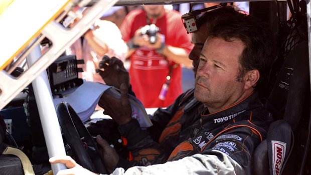 Robby Gordon of the US and co-pilot Johnny Campbell prepare to begin the 10th stage.