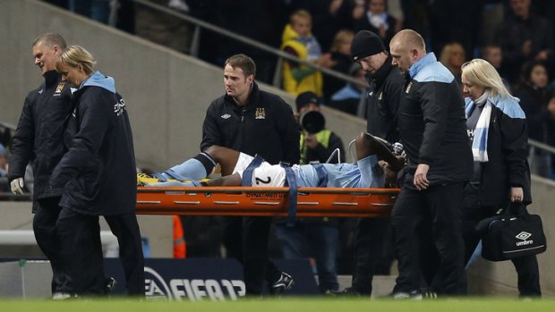 Manchester City's Micah Richards is carried off the pitch on a stretcher during the match against Swansea.