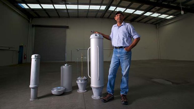 Tyrone Maloney with one of his pillars that are seen on nature strips throughout Australia.