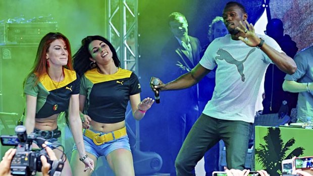 Usain Bolt entertains fans during a party at Puma Social Club in Gorky Park, Moscow.