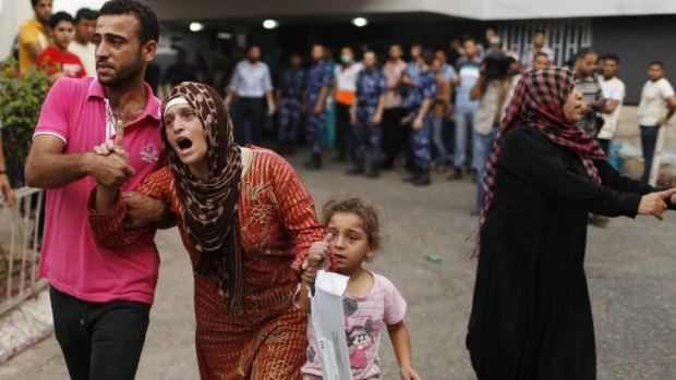 A Palestinian woman reacts after the death of her relatives, who medics said were killed in Israeli shelling on Sunday.