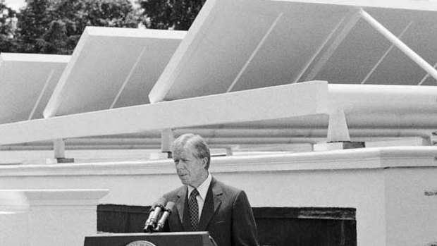 Jimmy Carter speaks against a backdrop of thermal solar panels at the White House in 1979.