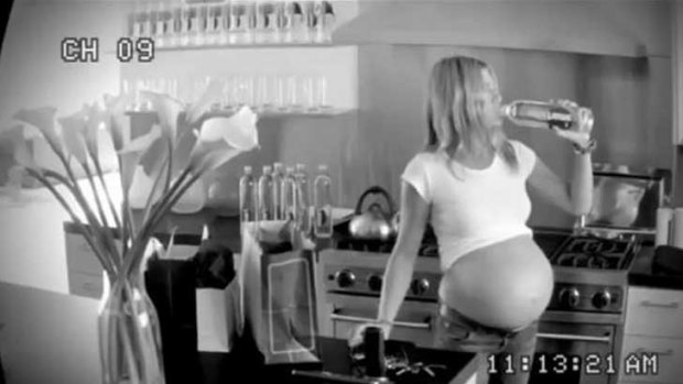 Jennifer Aniston is filmed with a very pregnant belly - sending up persistent tabloid rumours. <i>Source: Smartwater</i>