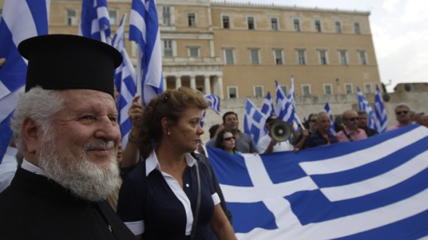 Austerity protest: Greece has reached agreement with eurozone partners on debt repayments, but austerity measures will remain.