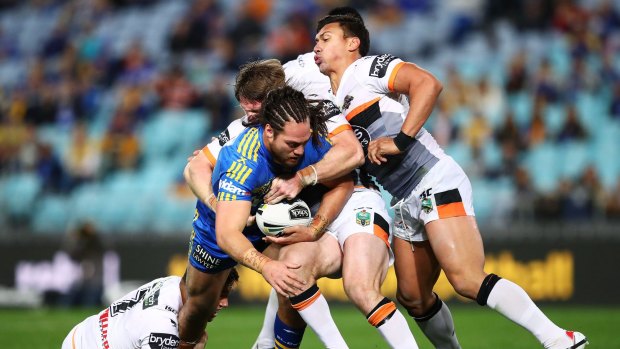 Tepai Moeroa tries to force his way through the Tigers line at ANZ Stadium. 
