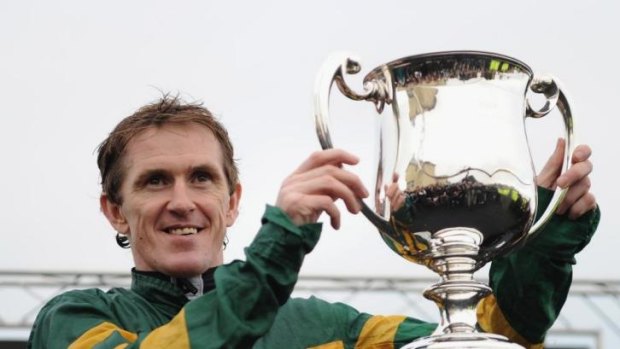 Tony McCoy celebrates after riding his 4000th winner at Towcester.