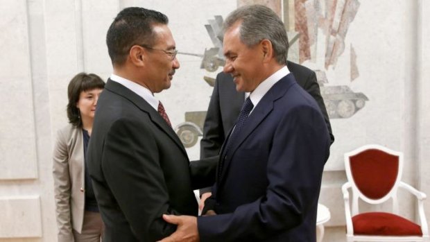 Russian Defence Minister Sergei Shoigu (right) welcomes his Malaysian counterpart Hishammuddin bin Tun Hussein (left) in Moscow.