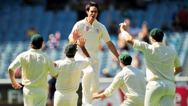 Mitchell Johnson is overjoyed after grabbing wickets with consecutive deliveries.