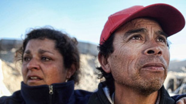 Anxious wait ... relatives of the miners trapped in the San Esteban gold and copper mine.