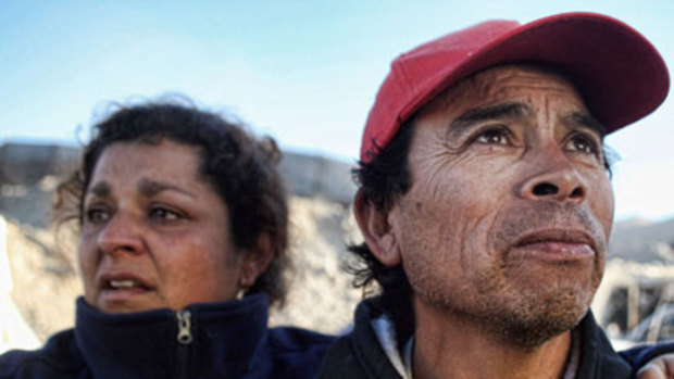 Anxious wait ... relatives of the miners trapped in the San Esteban gold and copper mine.