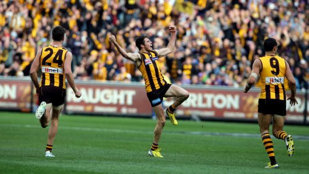 Isaac Smith celebrates his goal in Saturday's grand final.