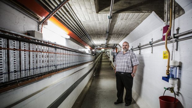 Asset manager for National Capital Authority Peter Beutel inside the gallery at Scriver Dam.