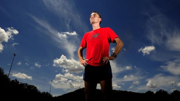 Canberra distance runner Martin Dent cools down after a training session on Reid Oval.