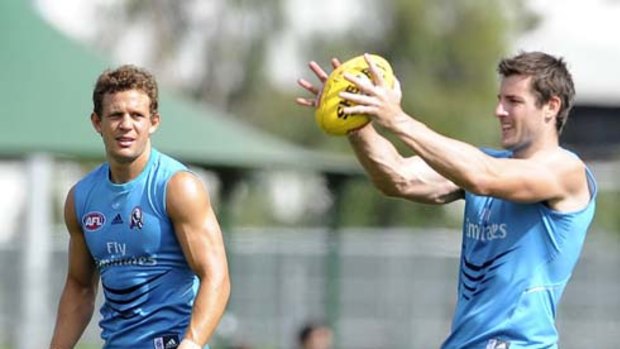 Star recruits Luke Ball, from St Kilda, and new leadership-group member Darren Jolly, from Sydney, sharpen their skills at a Collingwood training session.