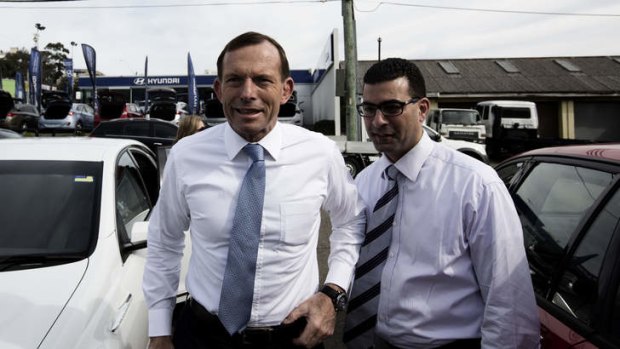 Campaign trail: Tony Abbott with Nickolas Varvaris, then Liberal candidate, now MP for Barton in Sydney. He unwittingly voted with Labor in Parliament on Wednesday after some conjecture of his state of wakefulness.