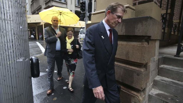 Kevin Yeo, (holding umbrella) brother of the deceased Rachelle Yeo, walks with Kathy and Roger Yeo as they enter the King Street Supreme Court for the sentencing submissions into the murder of their daughter. Photo: Nick Moir