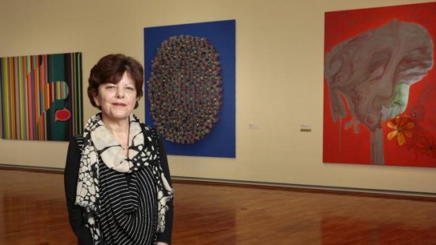 National Gallery of Australia senior curator Deborah Hart with some of the works by Australian painter Dale Frank.