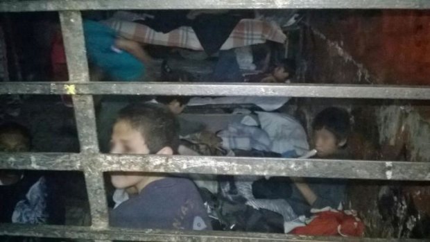 Squalid conditions ... Children rest in one of the rooms of the shelter "La Gran Familia"(The Big Family) during a police raid where 458 children were rescued.